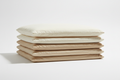 Folded luxury pillowcases in neutral tones