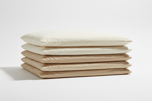 Folded luxury pillowcases in neutral tones